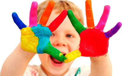 Boy with coloured paint on hands